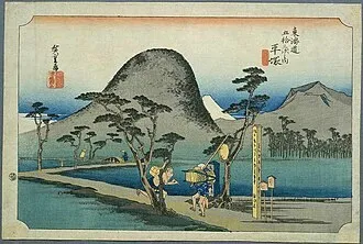 A historical woodblock view of Mount Koma and Mount Fuji